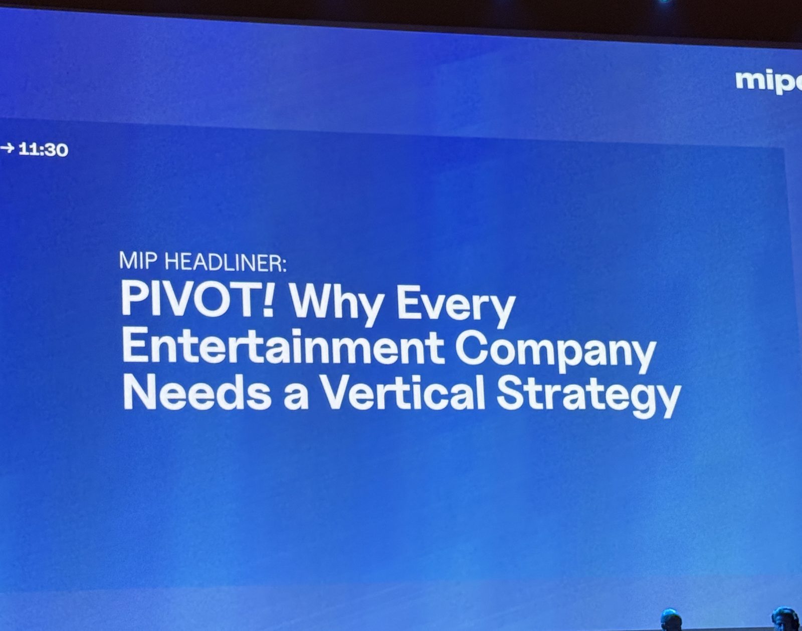 MIPCOM stage screen reading 'MIP Headliner: PIVOT! Why Every Entertainment Company Needs a Vertical Strategy'